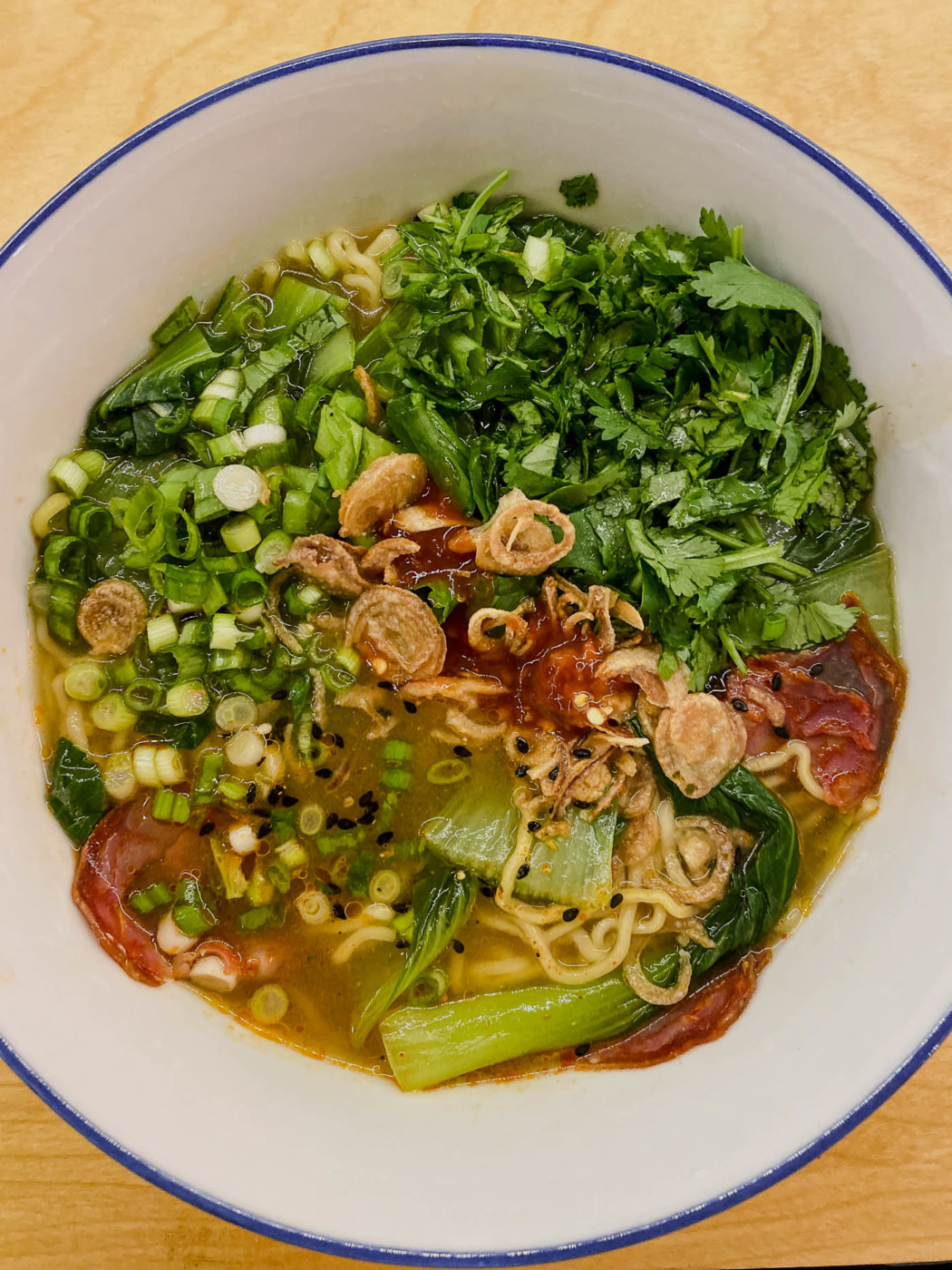 I like to throw the kitchin sink at my Ramen! Just kidding, but adding some chorizo and charred bok choy to a homemade miso and shiitake broth was one of these cooking with whats left in the fridge that ended up on repeat.